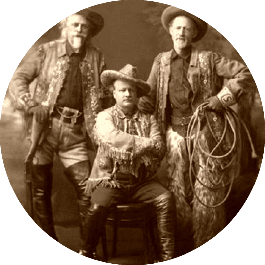 Three men in cowboy hats and coats posing for a picture.